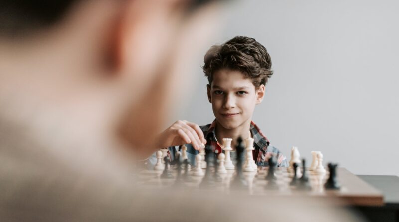 a boy playing chess