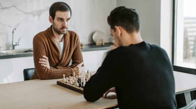 men playing chess together